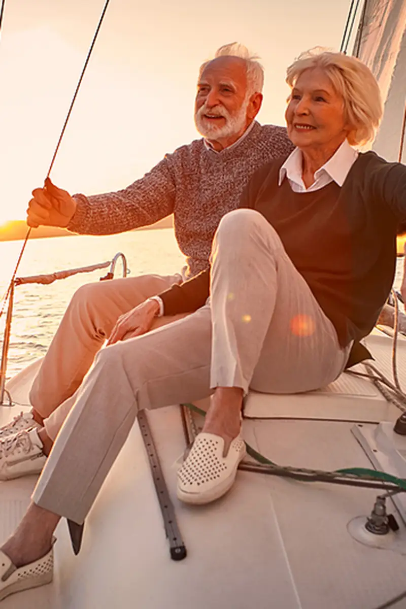 Retired couple enjoying sailing