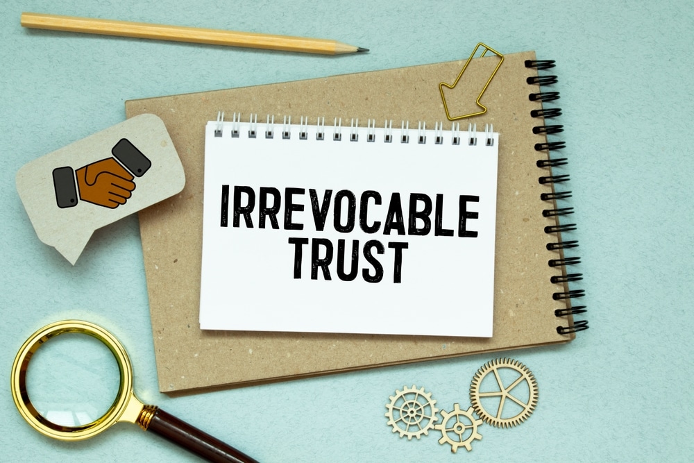 IrrevocableTrustTextOnWhiteStickerAndPen